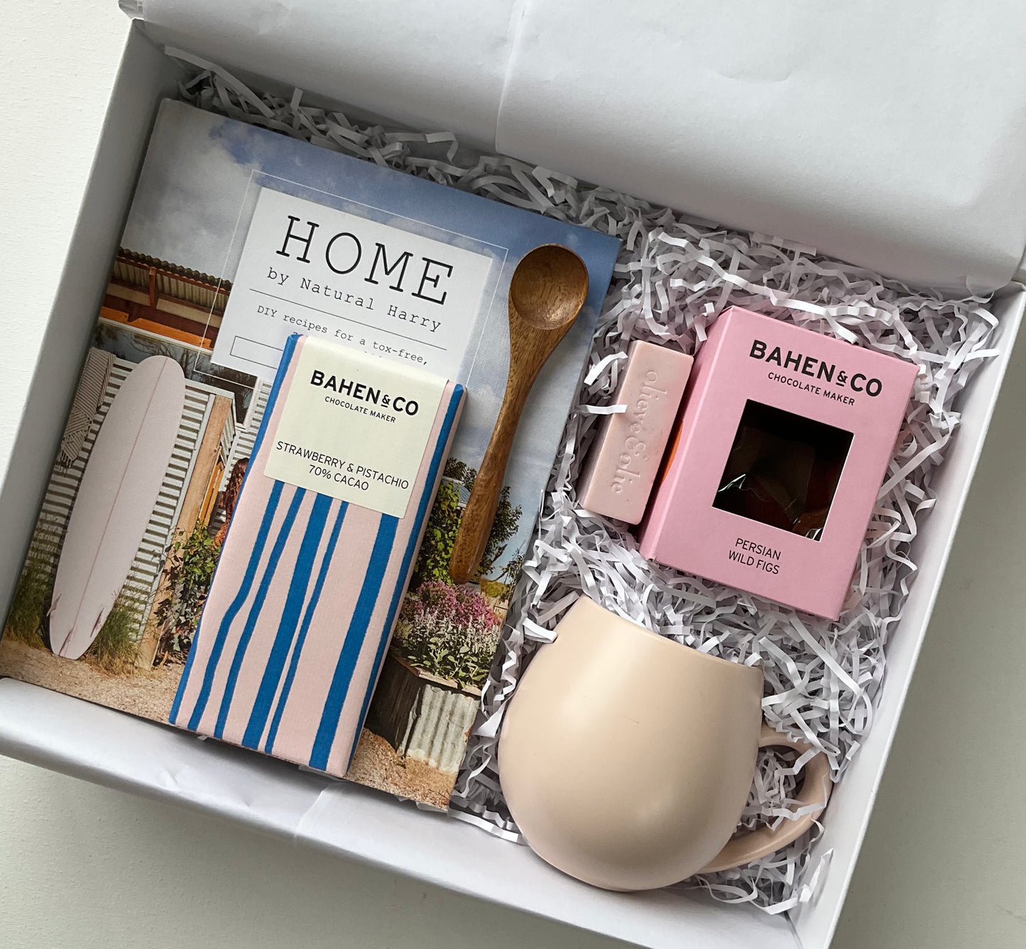 Natural Home gift hamper featuring a book, mug, chocolate