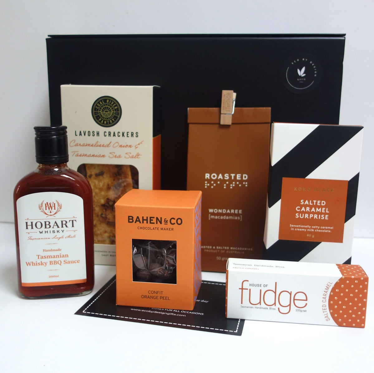 Tasmanian gourmet gift hamper featuring Hobart Whisky BBQ Sauce, lavosh crackers, Bahen & Co chocolate, and more.