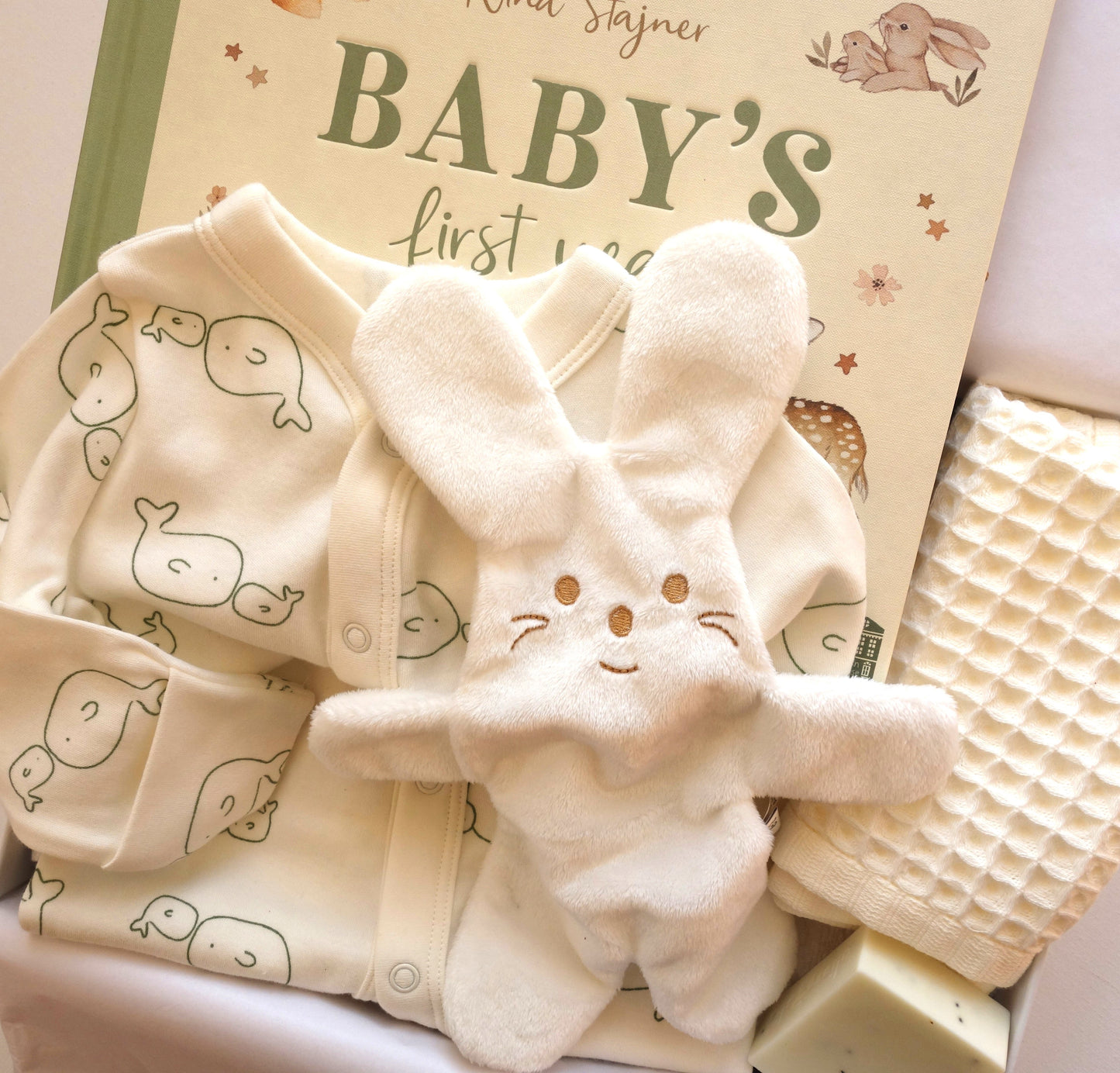 Snuggle Baby Hamper featuring unisex baby gift hamper with whale bodysuit, baby record book, and soft comforter.