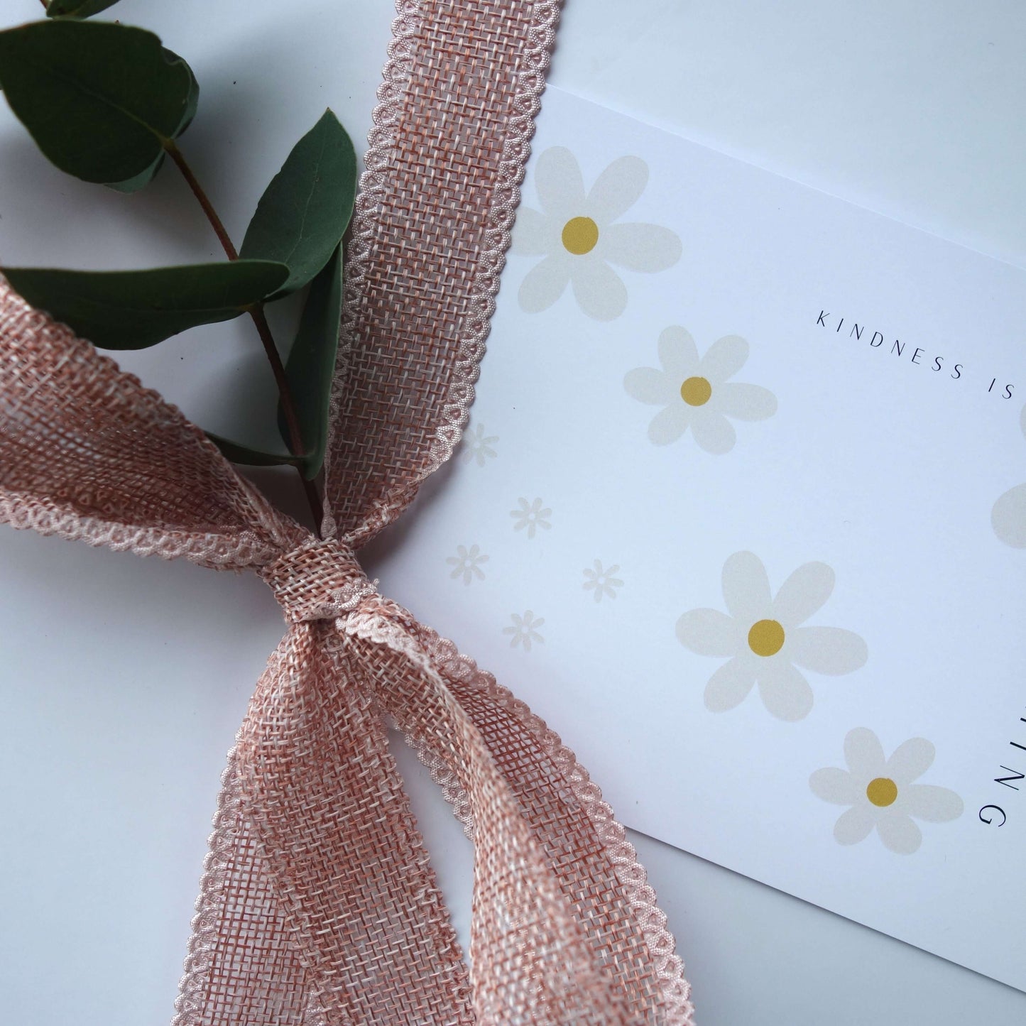 Grounded Gift Hamper with a pink ribbon and floral card, symbolizing relaxation and slow living.