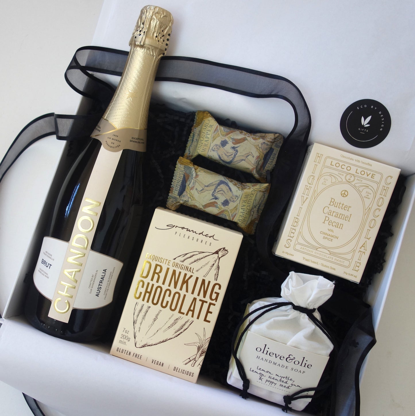 Celebrate & spoil her with this gift box featuring Chandon sparkling wine, drinking chocolate, and caramel pecan chocolates - great gift ideas for her.