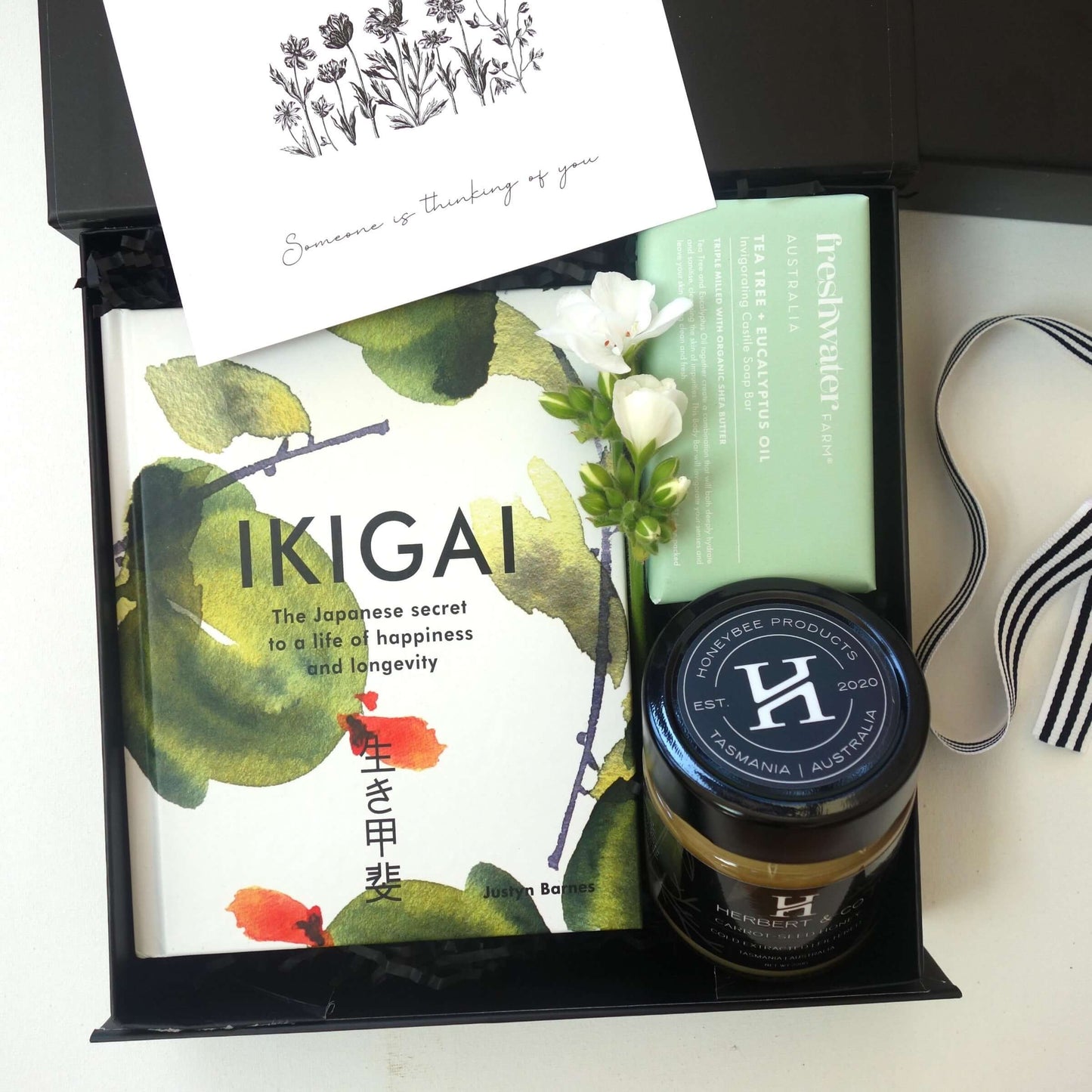 Ikigai gift box featuring book, Tasmanian honey, soap, and flowers for a mindful experience.