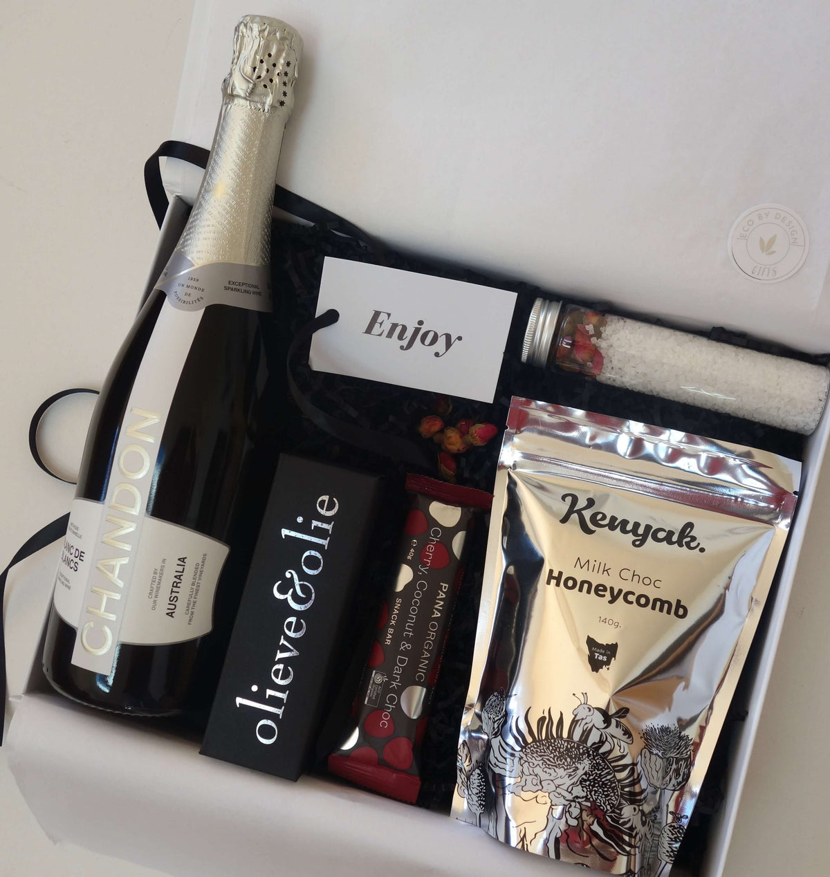 Luxury female gift box featuring Chandon champagne, chocolate honeycomb, and gourmet treats.