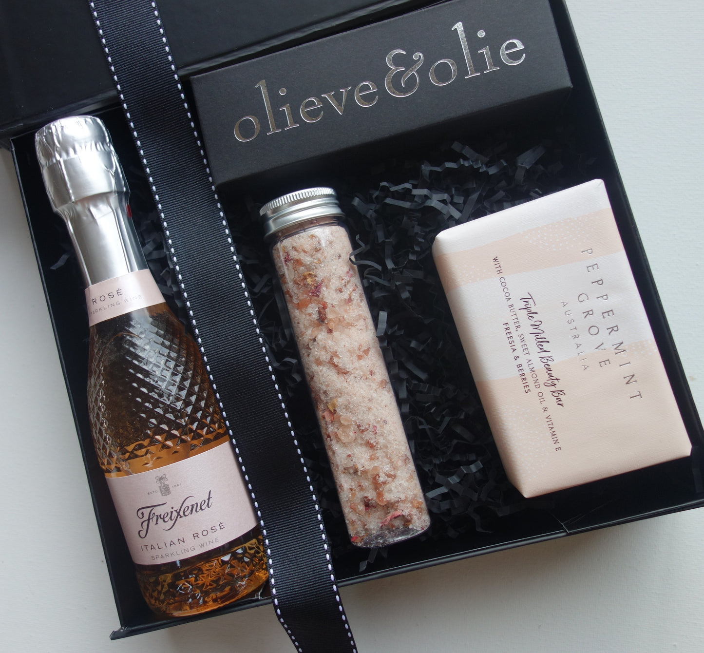 Sweet Moments gift box featuring Freixenet Rose wine, luxury bath soak, and Peppermint Grove soap bar for Moments.
