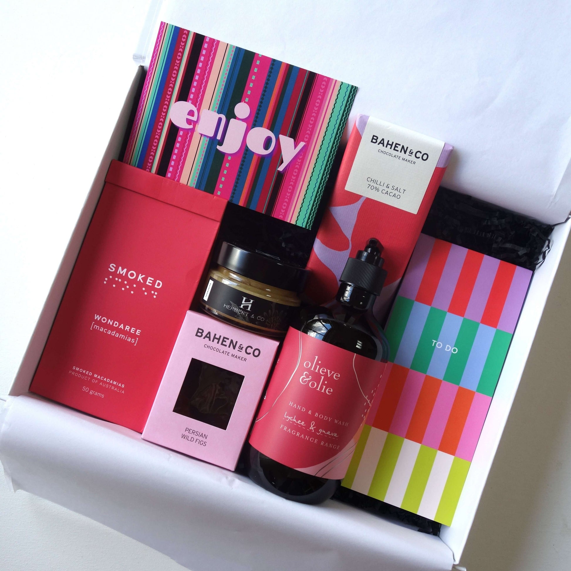 Bright and beautiful gift hamper for her featuring luxury products and gourmet treats.