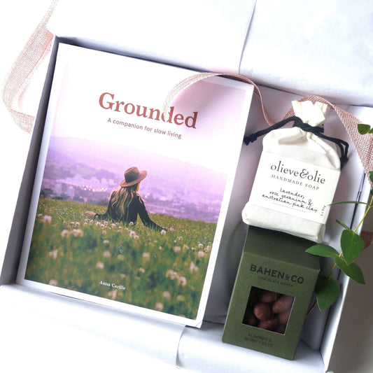 Grounded Gift Hamper featuring the book 'Grounded', handmade soap, and gourmet chocolates.