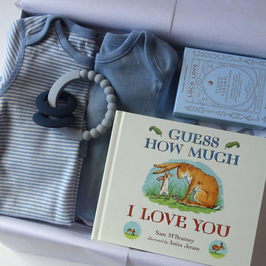 Guess how much i love you baby gift set featuring bodysuits, book, and a teether for new arrivals.