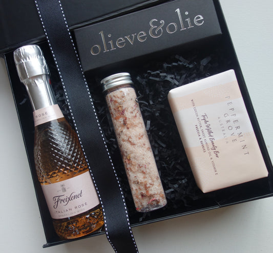 Sweet Moments gift box featuring Freixenet Rose wine, luxury bath soak, and Peppermint Grove soap bar for Moments.