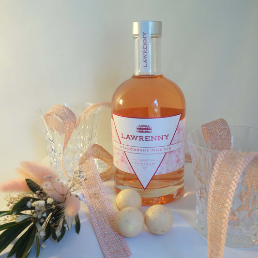 Tasmanian gin lover's gift featuring Lawrenny pink gin, elegant glassware, and decorative elements.